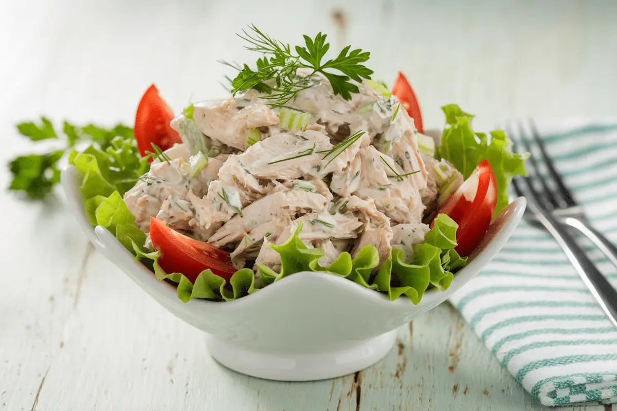 Homemade Chicken Salad Chick Recipe served on a plate with crackers.