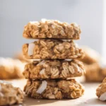 A stack of freshly baked Ranger Cookies showcasing their chewy texture and oat-filled goodness.