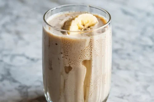 Banana Boat Smoothie in glass on marble surface